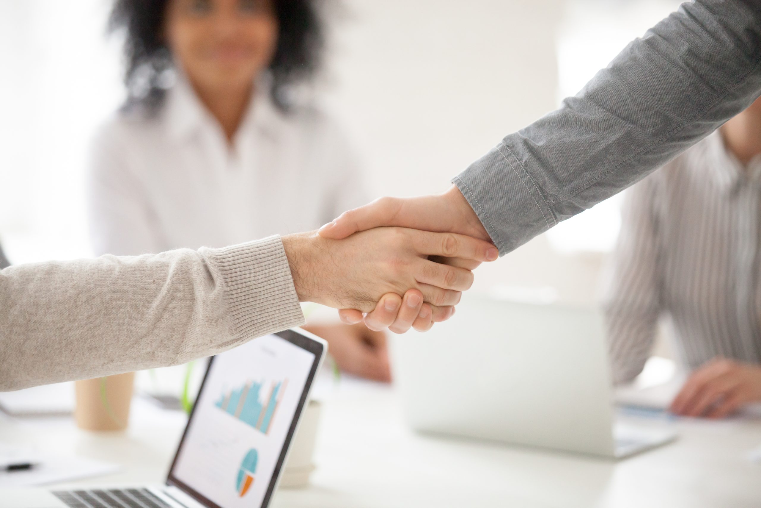 business partners handshaking group meeting making project investment closeup scaled