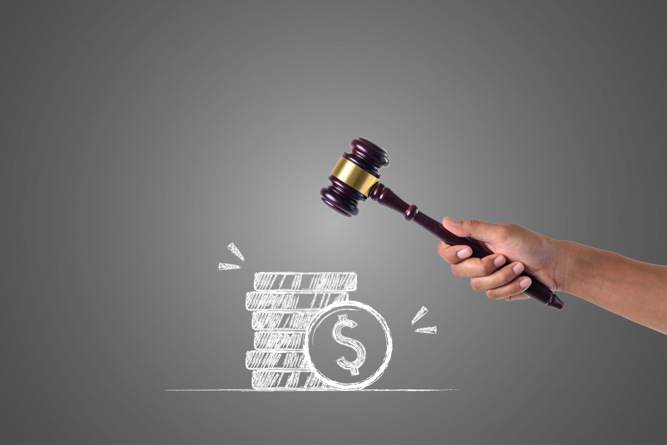 hand that holds hammer piles money written with white chalk draw concept scaled
